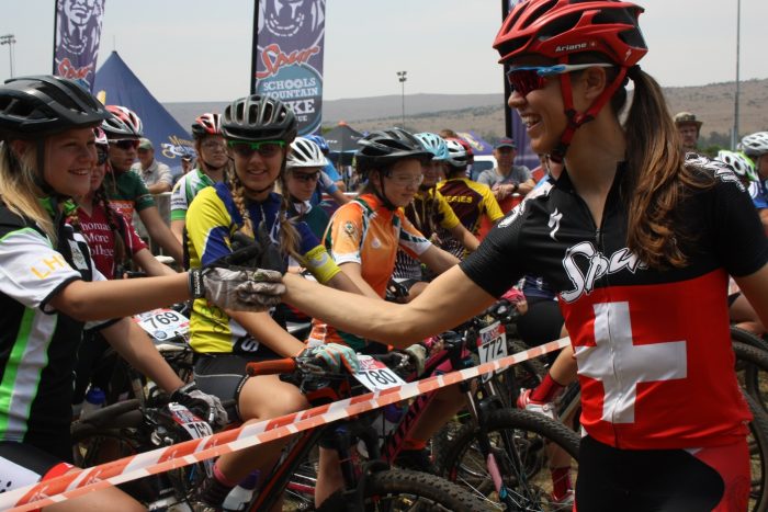 Ariane-Kleinhans-of-Team-Spur-wishing-the-youth-women-15-years-good-luck-before-their-race